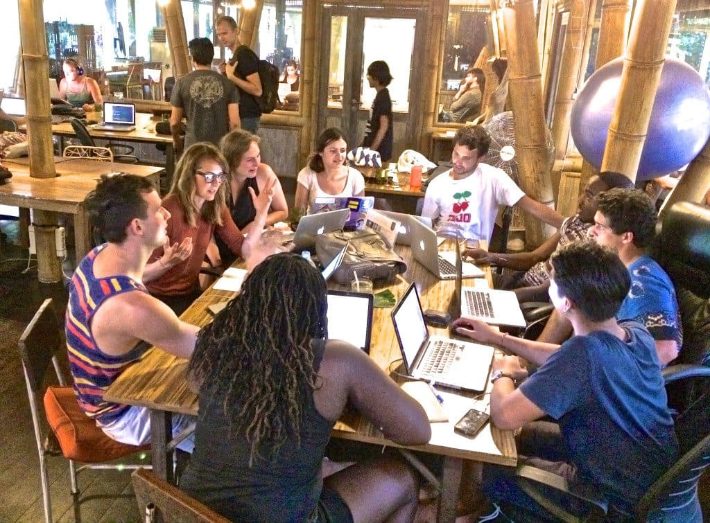Digital nomads working in a co-working space in Ubud, Bali