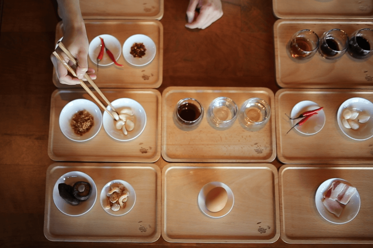 Film still — chefs discussing flavor composition